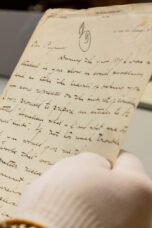 A researcher browses letters and photographs at the Bentley Historical Library.