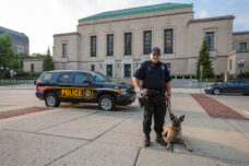 A U-M police officer  and his K-9 dog out on campus patrol.