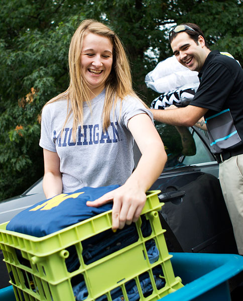 A Michigan dad helps out his freshman daughter during move-in day at Bursley Hall