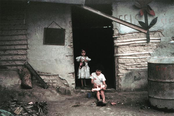 Children in front of war-torn school