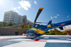 The Survival Flight helicopter sits on the landing pad outside of Taubman Center waiting for the next emergency call.